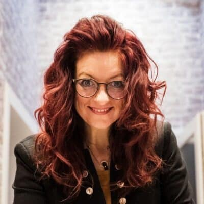 Inhaberin Christiane Münster lächelnd, mit direktem Blick.
